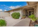 Inviting covered patio featuring decorative wrought iron details and room for outdoor enjoyment at 12810 W Ashwood Dr, Sun City West, AZ 85375