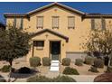 Traditional two-story home featuring symmetrical design, desert landscaping, and a welcoming front entrance at 16648 W Jenan Dr, Surprise, AZ 85388