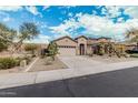 Attractive house with a xeriscaped yard, a two-car garage, and a well-maintained exterior at 29997 N 70Th Dr, Peoria, AZ 85383