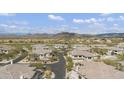 Birds eye view of neighborhood showcasing desert landscaping, golf course and mountain views at 33575 N Dove Lakes Dr # 2036, Cave Creek, AZ 85331