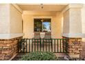 Cozy covered porch with decorative columns and chairs, perfect for relaxing outdoors at 4189 E Sandy Way, Gilbert, AZ 85297