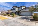 Charming two-story home with a two-car garage, desert landscaping, and a covered front entryway at 5513 S Coyote Cyn, Mesa, AZ 85212