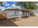 Street view of single story home with desert landscaping and mature trees in the front yard at 7022 N 26Th Dr, Phoenix, AZ 85051