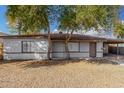 Charming single story home with desert landscaping and mature trees in the front yard at 7022 N 26Th Dr, Phoenix, AZ 85051