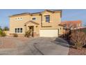 Two-story home featuring desert landscaping, neutral color scheme, and solar panels at 7611 S 15Th St, Phoenix, AZ 85042