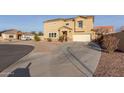 View of two-story home featuring desert landscaping, neutral color scheme, and solar panels at 7611 S 15Th St, Phoenix, AZ 85042