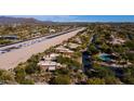 Stunning aerial view of SkyRanch at Carefree homes along a private airstrip runway and serene desert landscape at 8502 E Cave Creek Rd # 10, Carefree, AZ 85377