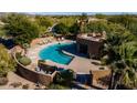 Aerial view of the large outdoor pool and patio area, surrounded by desert landscaping at 8502 E Cave Creek Rd # 10, Carefree, AZ 85377