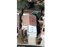 Aerial view of a tile roofed home and backyard with a pool in a desert community at 9796 E Stone Cir Ln, Gold Canyon, AZ 85118