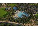 Aerial view of the community pool and surrounding area shows the recreational activities and amenities at 9849 S Caballo Dr, Apache Junction, AZ 85120