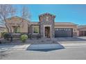 Inviting single-story home featuring manicured desert landscaping, stone accents, and a convenient two-car garage at 10039 W Jasmine Trl, Peoria, AZ 85383