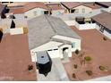 Attractive home featuring a spacious driveway and tidy desert landscaping at 1418 E Peggy Dr, Casa Grande, AZ 85122