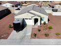 Inviting single-story house with a two-car garage and well-maintained gravel yard at 1418 E Peggy Dr, Casa Grande, AZ 85122