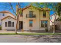 Charming two-story home with a balcony and well-manicured front yard at 1422 S Colt Dr, Gilbert, AZ 85296