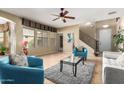 Open living room with lots of light, staircase, and tile floors at 1422 S Colt Dr, Gilbert, AZ 85296