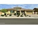Charming single-story home with desert landscaping, a tile roof, and a two-car garage at 15960 W Bonitos Dr, Goodyear, AZ 85395