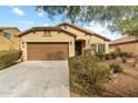 Charming single-story home features a two-car garage and meticulously maintained landscaping at 17550 W Buckhorn Trl, Surprise, AZ 85387