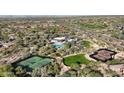Stunning aerial view of the community amenities including tennis, golf course, and a pool at 18515 N 94Th St, Scottsdale, AZ 85255