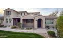 Charming exterior elevation of a two-story home featuring elegant architectural details and a welcoming entrance at 18515 N 94Th St, Scottsdale, AZ 85255