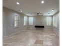 Spacious living room with plantation shutters, recessed lighting, and tile floors, perfect for relaxing at 18515 N 94Th St, Scottsdale, AZ 85255