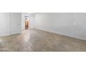 Bright, open living space with neutral tile flooring and natural light from sliding glass doors at 2220 W Dora St # 129, Mesa, AZ 85201