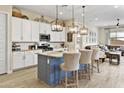 Gourmet kitchen featuring granite countertops, stainless steel appliances, and a stylish island at 24757 N 175 Dr, Surprise, AZ 85387