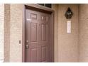 Close-up of a secure front door with a visible house number and security features at 2875 W Highland St # 1213, Chandler, AZ 85224