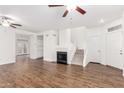 Bright living room with hardwood floors, a fireplace, and a staircase at 2875 W Highland St # 1213, Chandler, AZ 85224