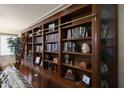 Floor-to-ceiling custom wood bookcase with ladder at 3134 N 145Th Ave, Goodyear, AZ 85395