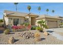 Attractive single-story home featuring a tile roof, desert landscaping, and a private front patio at 3362 N 159Th Ave, Goodyear, AZ 85395