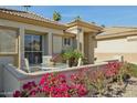 Cozy front patio featuring stylish outdoor furniture and lush landscaping at 3362 N 159Th Ave, Goodyear, AZ 85395