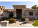 Beautiful entrance with stone accents and well-manicured desert landscaping at 3631 S Greythorne S Way, Chandler, AZ 85248