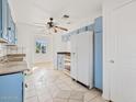 Kitchen with updated appliances and light blue cabinets, offering ample counter space at 724 S Lewis --, Mesa, AZ 85210