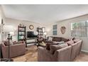 Spacious living room featuring a large comfortable sofa and stylish decor at 8155 E Roosevelt St # 112, Scottsdale, AZ 85257
