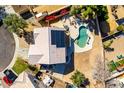 An aerial view of a private backyard pool and a home with solar panels at 8812 N 67Th Dr, Peoria, AZ 85345