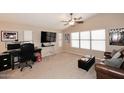 Comfortable bedroom with vaulted ceilings, carpet, and a ceiling fan at 9658 E Olla Ave, Mesa, AZ 85212