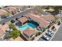 Aerial view of a luxurious home with a private pool, multiple car parking, and desert landscaping at 9718 E Boston St, Mesa, AZ 85207