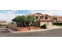 Charming two-story home with a red tile roof and desert landscaping on a corner lot at 14009 N 30Th St, Phoenix, AZ 85032