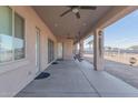 Wide view of the covered patio with ceiling fans and a view of the horse property at 1444 W Gail Rd, San Tan Valley, AZ 85144