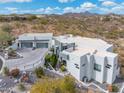 Modern home with a multi-car garage and desert landscaping set in a desert community at 15642 E Palatial Dr, Fountain Hills, AZ 85268