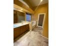 Bright bathroom featuring a soaking tub and a dual sink vanity at 1870 N 128Th Dr, Avondale, AZ 85392