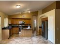 Spacious kitchen with stainless steel appliances, an island, and ample cabinet space at 1870 N 128Th Dr, Avondale, AZ 85392