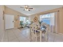 Inviting dining room featuring a decorative nautical theme, large windows, and comfortable seating at 2019 E Wahalla Ln, Phoenix, AZ 85024