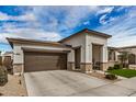 Beautiful home featuring a two-car garage, desert landscaping, and a welcoming front entryway at 22864 E Via Del Sol --, Queen Creek, AZ 85142