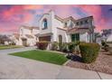 Charming street view showcasing two-story homes with tile roofs, manicured lawns, and desert landscaping at 2300 W Sunrise Pl, Chandler, AZ 85248