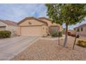 Charming single-story home with low-maintenance desert landscaping and an attached two-car garage at 233 N 21St St, Coolidge, AZ 85128