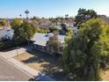 Aerial view of a charming home with a covered front porch, set in a lush neighborhood at 3511 E Elm St, Phoenix, AZ 85018