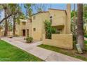 Attractive two-story exterior elevation with private balconies and desert landscaping at 6542 N 7Th Ave # 30, Phoenix, AZ 85013
