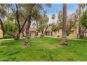 Community exterior features lush green spaces with mature trees and landscaping at 6542 N 7Th Ave # 30, Phoenix, AZ 85013