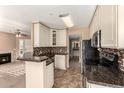 Well-equipped kitchen with granite counters, tiled backsplash, and easy access to the living areas at 1295 N Ash St # 125, Gilbert, AZ 85233